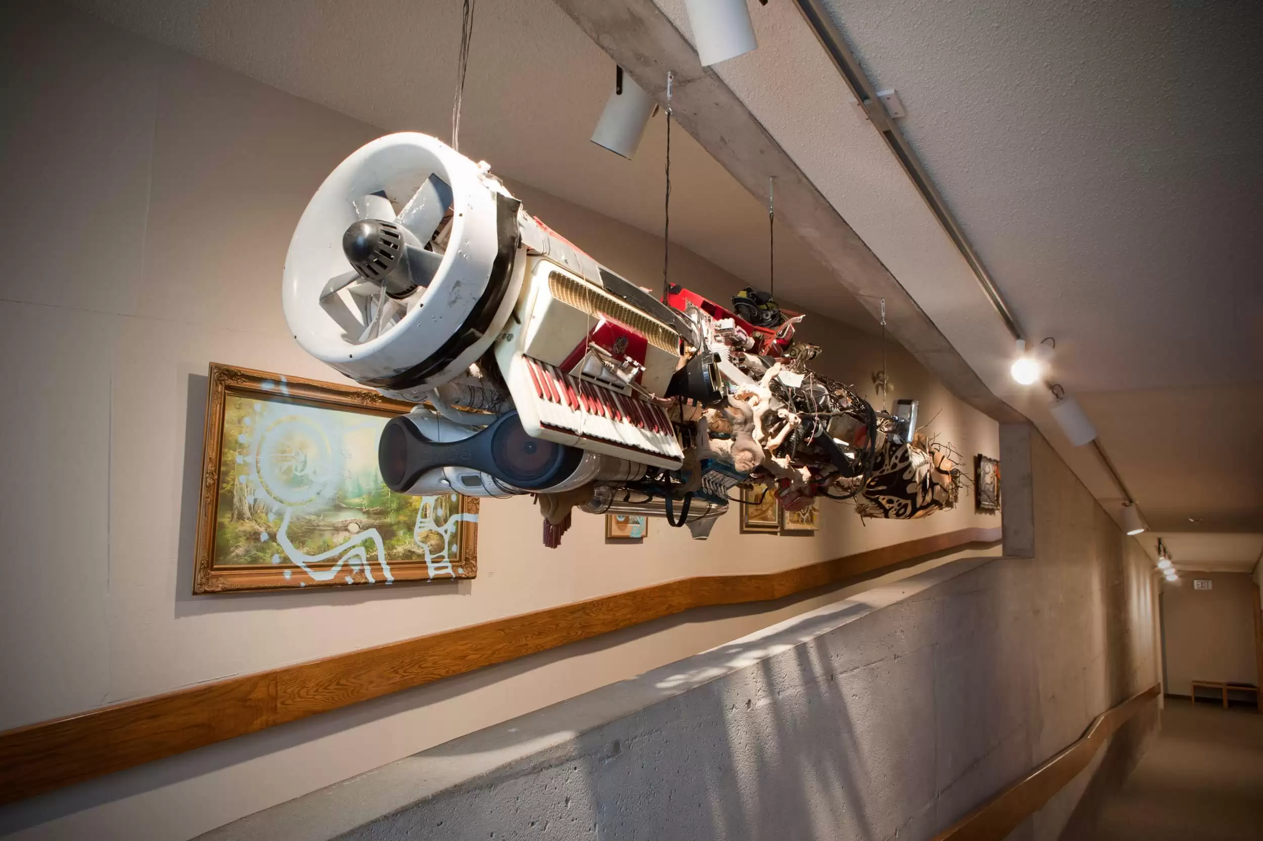 Sculpture by Jimson Bowler suspended on the AGP ramps. Assemblage of outdated technologies creating a space/canoe-ship like vessel.