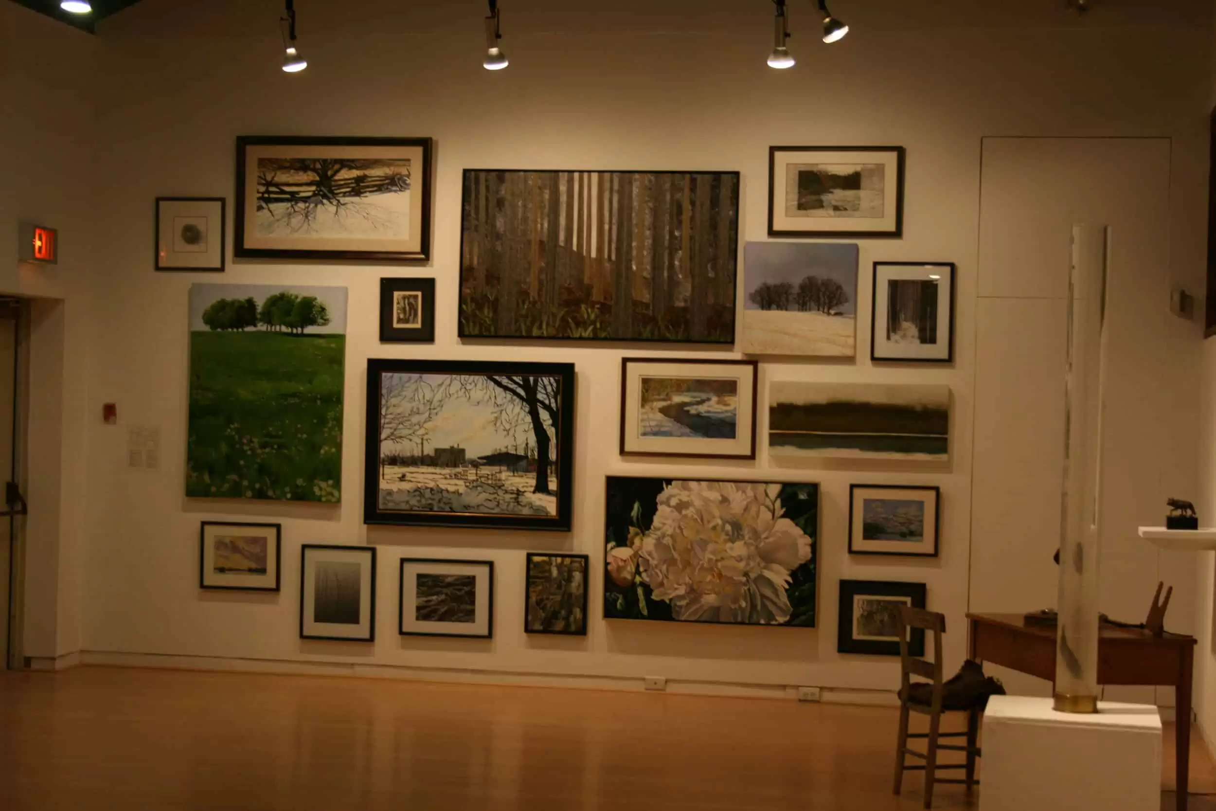 Gallery view of the Triennial exhibition featuring multiple pantings and sculptures installed in the AGP's main gallery