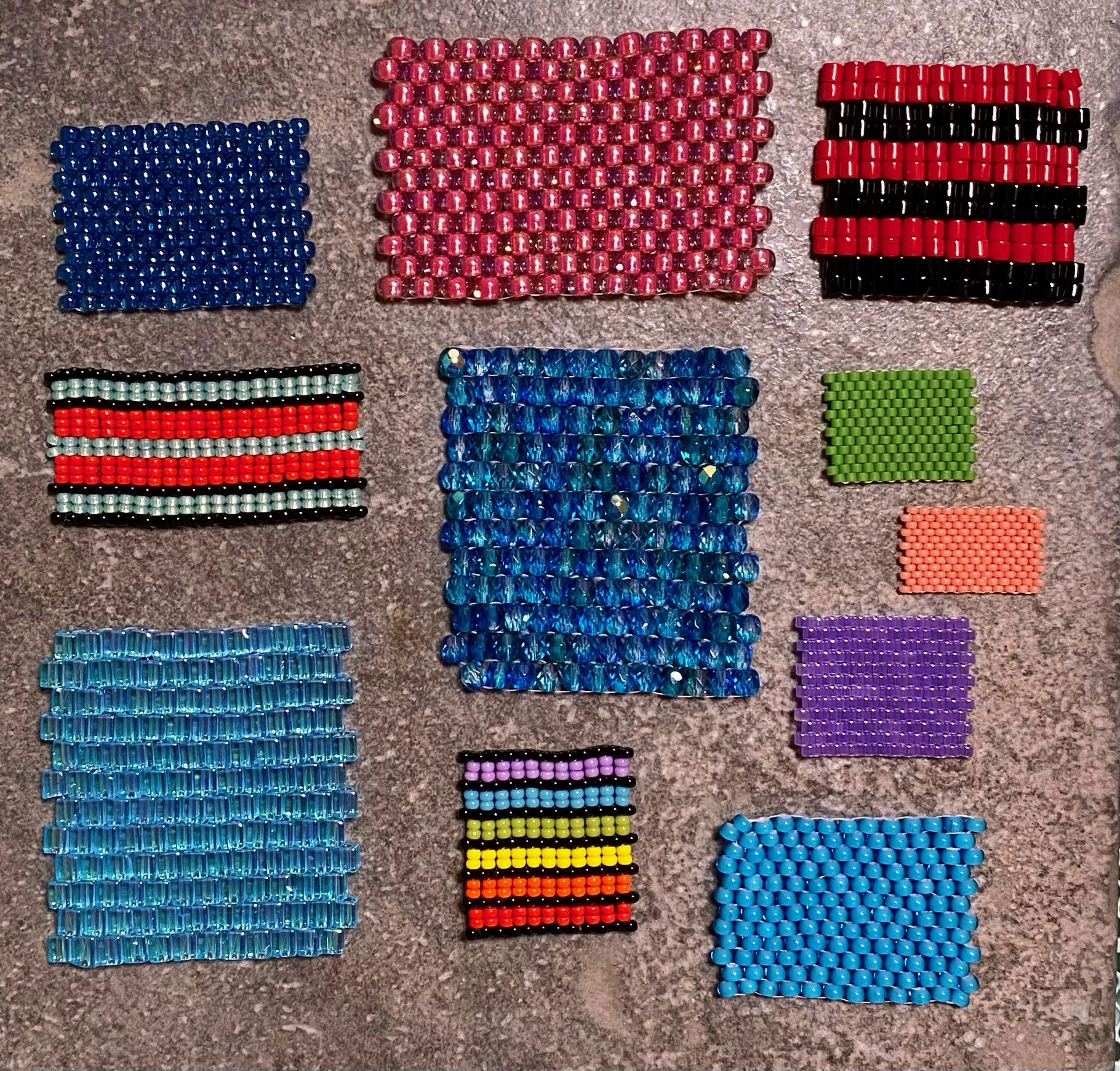 11 rectangles of peyote stich beadwork in various colours on a brown background by artist Olivia Whetung