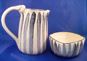 Pitcher and bowl ceramic by Suzanne Woods. White with blue stripes.