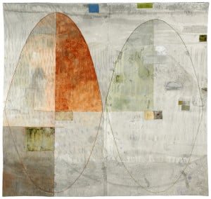 Textile work by Dorothy Caldwell. White, grey, and orange patchwork squares with two ovals.