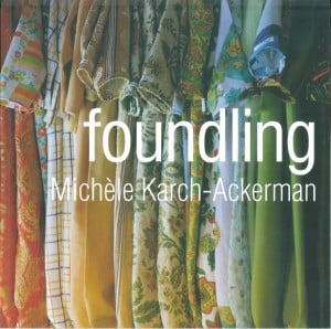 Foundling catalgoue cover. Series of handing colourful children's onesies. Text reads: "Foundling Mchéle Karch-Ackerman."