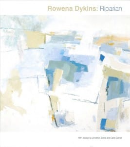 Riparian catalogue cover featuring an abstract painting by Rowena Dykins. Gestural brush strokes in muted blue, yellow, green, and white. Text reads "Rowena Dykins: Riparian, with essays by Jonathan Bordo and Carla Garnet."