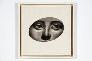 Grayscale rendering on a person's eyes on an handwoven linen canvas with a white frame by Lorène Bourgeois and Suzanne Swannie
