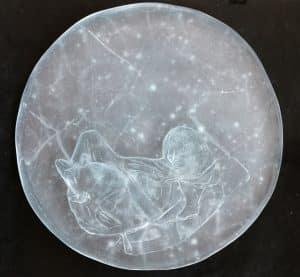 Etched glass sculpture by Bonnie Devine featuring the maiden of Mount Llullaillaco