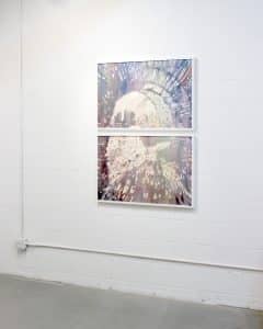 Two panel watercolour painting by Laura Madera installed on a white wall