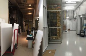 Two photographs showing AGP's vault before and after renovations. Left side photograph features a cluttered storage space with paintings on large trollies. Right side photograph features an organized storage space with paintings hanging on metal grid walls.