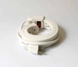 Michelle Bellemare's plymer clay and metal sculpture of an unplugged power bar curled into a circular shape