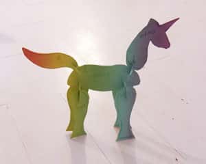 Three dimensional paper collage of a multicoloured unicorn