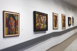 Gallery view of the exhibition Arthur Shilling The Final Works featuring multiple oil paintings installed on the AGP ramps