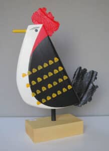 Carved and painted wood sculpture of a rooster by John Boorman