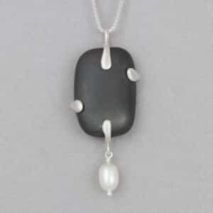 Pendant made of Sterling silver, river stone, and freshwater pearl by Sandy MacFarlane