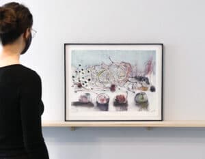 person viewing artwork on a gallery wall
