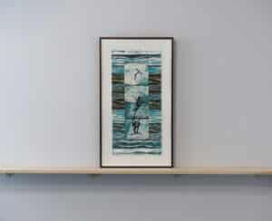 Framed aquarelle mono print collage by Louise Laroche sitting on a wooden ledge installed on the AGP ramps