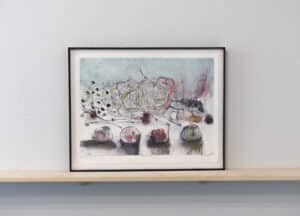 Framed monotype print by Jane LowBeer sitting on a wooden ledge installed on the AGP ramps