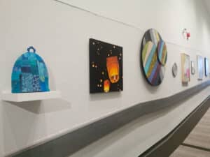 various artworks of varying mediums by multiple artists installed in an exhibition at the Art Gallery of Peterborough
