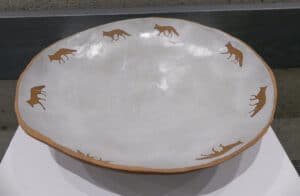 ceramic bowl in pale grey with foxes around the interior rim