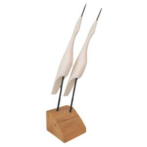 two stylized egrets pointing skyward attached to a natural wooden base by two dowels painted black