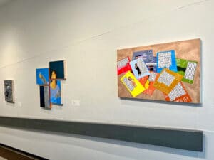 youth art painting in an art gallery featuring bright colours and text