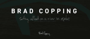 cover of the digital publication with white text on a dark background that says: Brad Copping setting afloat on a river in spate