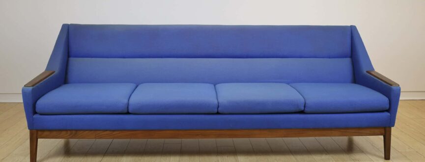 teak sofa with blue upholstery