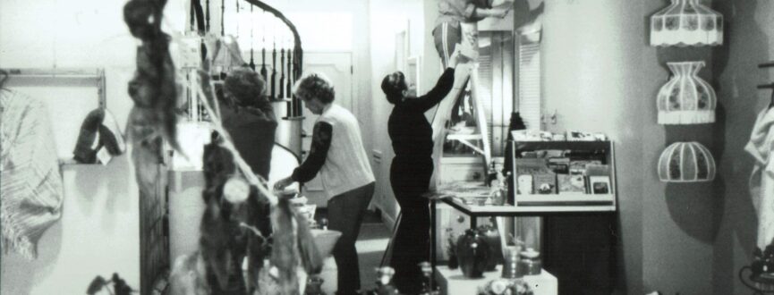 archival photo of gallery staff and volunteers setting up for an event in what is now the gallery shop