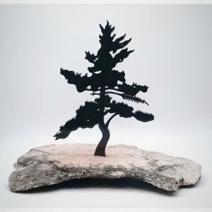 A black single pine tree silhouette is fixed onto a grey and black speckled granite base.